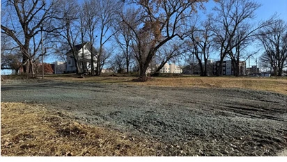 A vacant Kansas City lot shown in the supplied project materials.